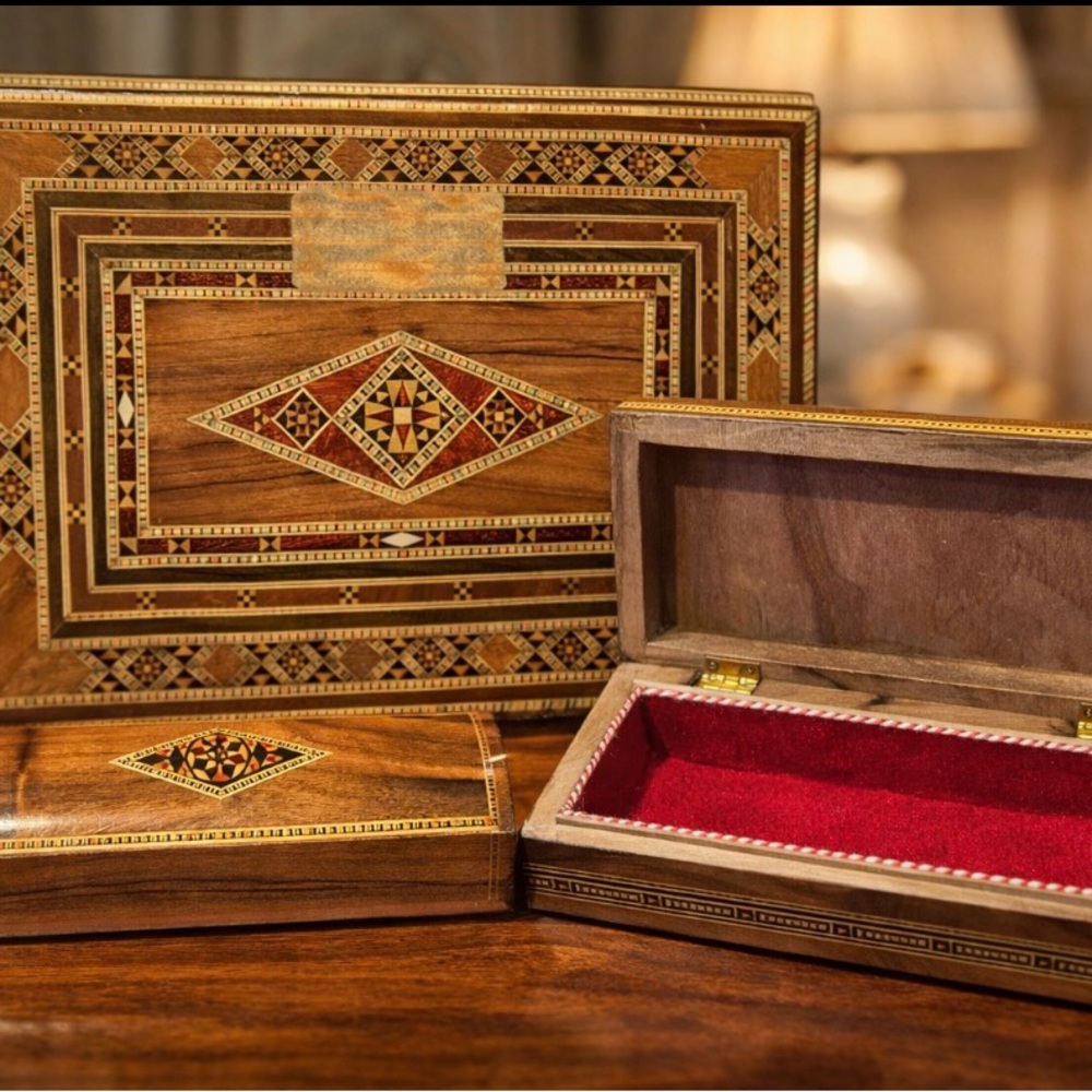 Beautiful handcrafted wooden box set with intricate geometric inlay design.